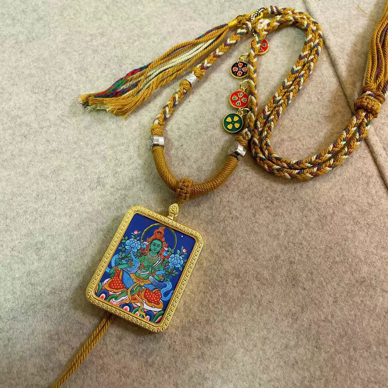 Green Tara - Handcrafted Gold Tibetan Thangka Necklace with Soft Yarn Cord