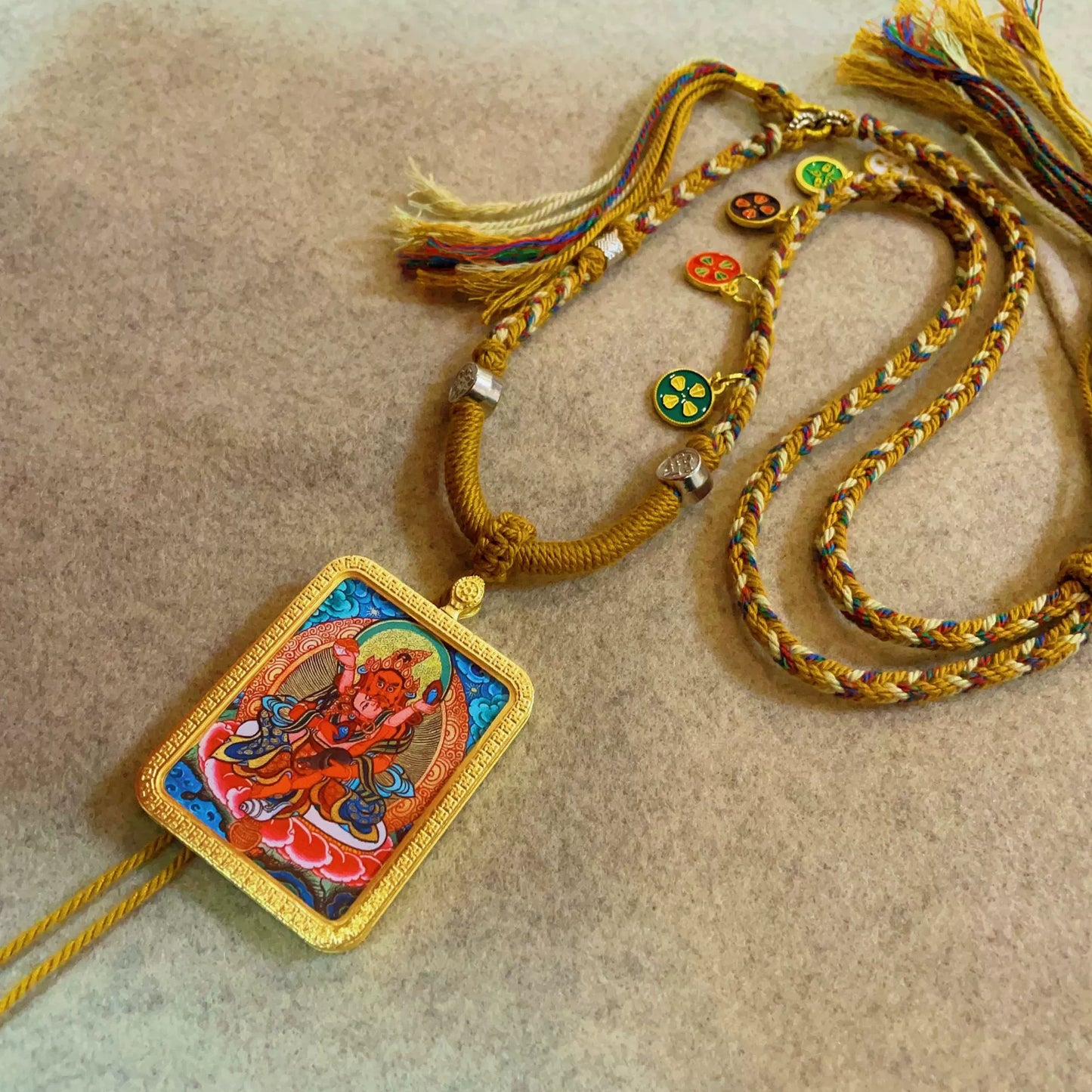 Red Jambhala (God of Wealth) - Handcrafted Gold Tibetan Thangka Necklace with Soft Yarn Cord