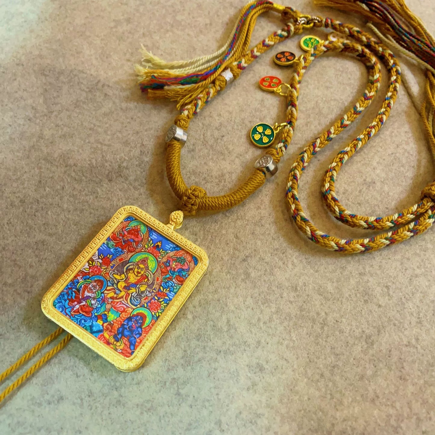 The Five Jambhalas (God of Wealth) - Handcrafted Gold Tibetan Thangka Necklace with Soft Yarn Cord