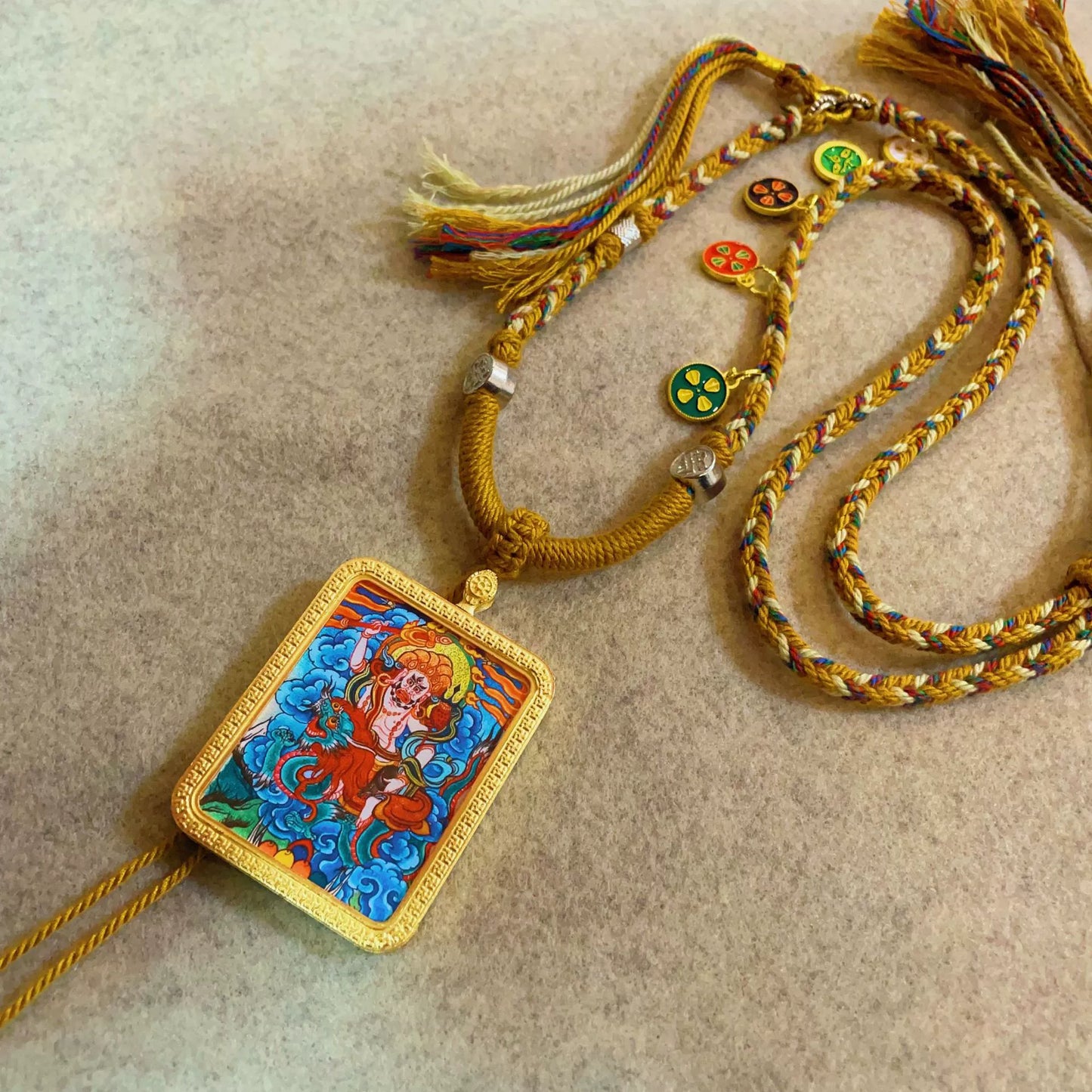 White Jambhala (God of Wealth) - Handcrafted Gold Tibetan Thangka Necklace with Soft Yarn Cord
