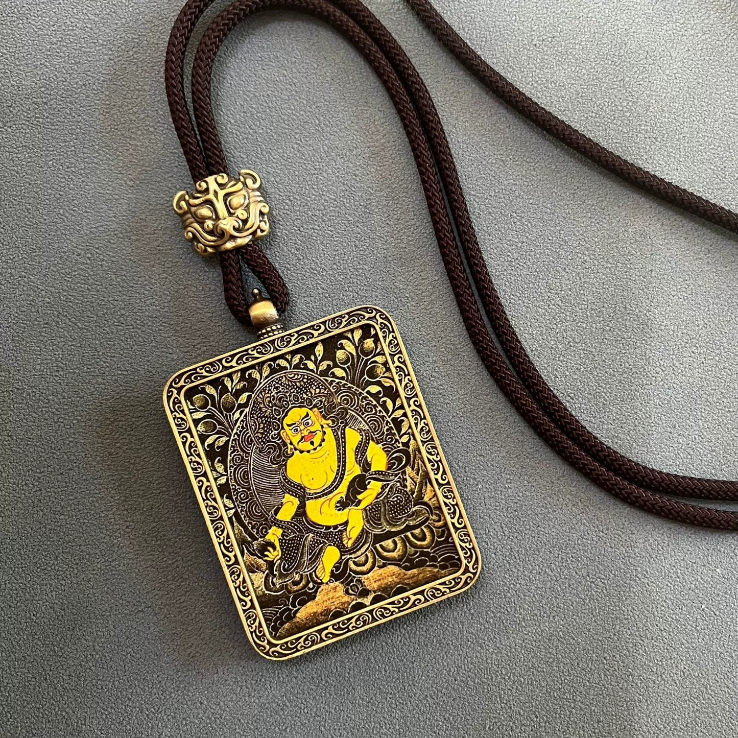 Yellow Jambhala (Black-Gold) - Handmade Tibetan Thangka Amulet Pendant (Antique Bronze)