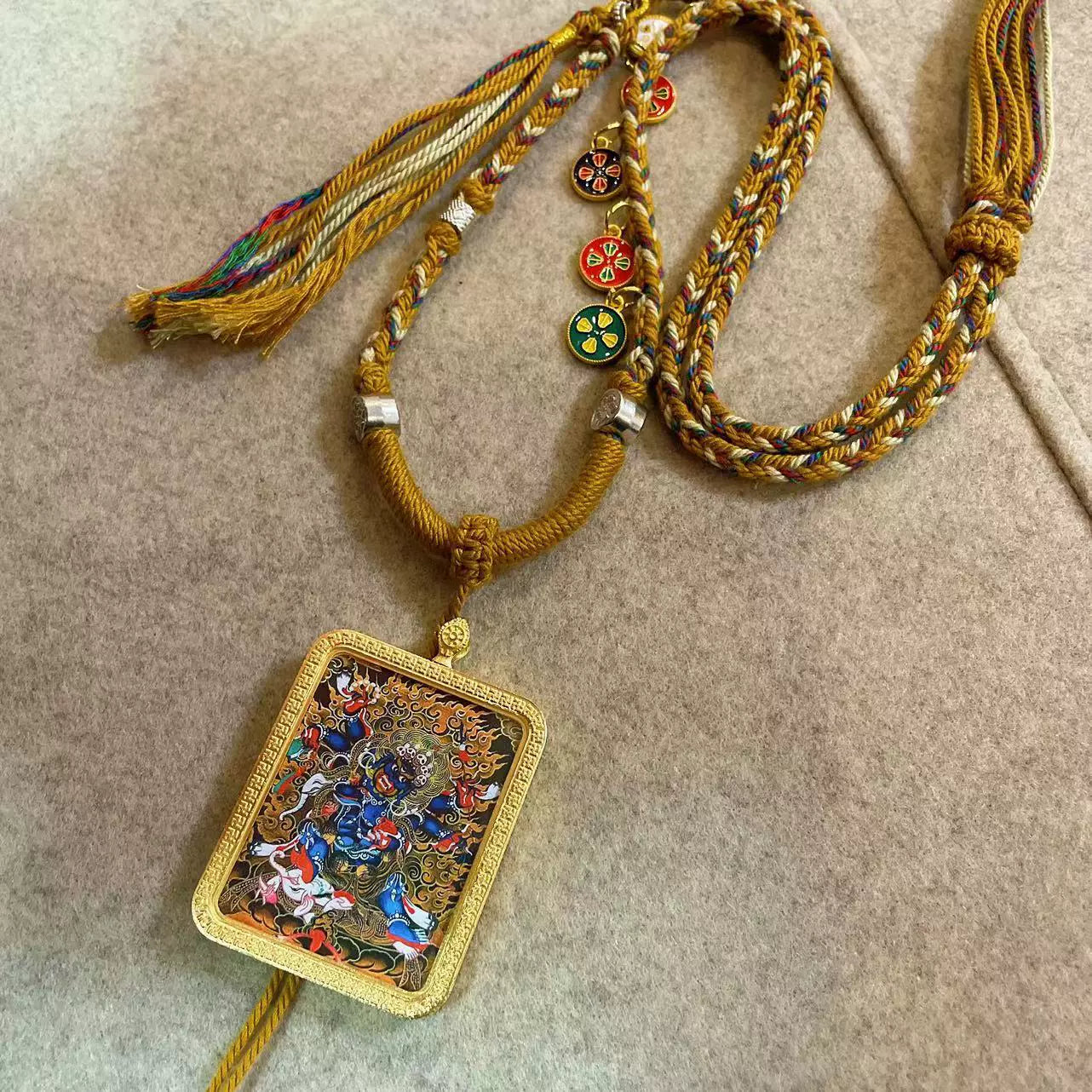 Six-Armed Mahakala - Handcrafted Gold Tibetan Thangka Necklace with Soft Yarn Cord